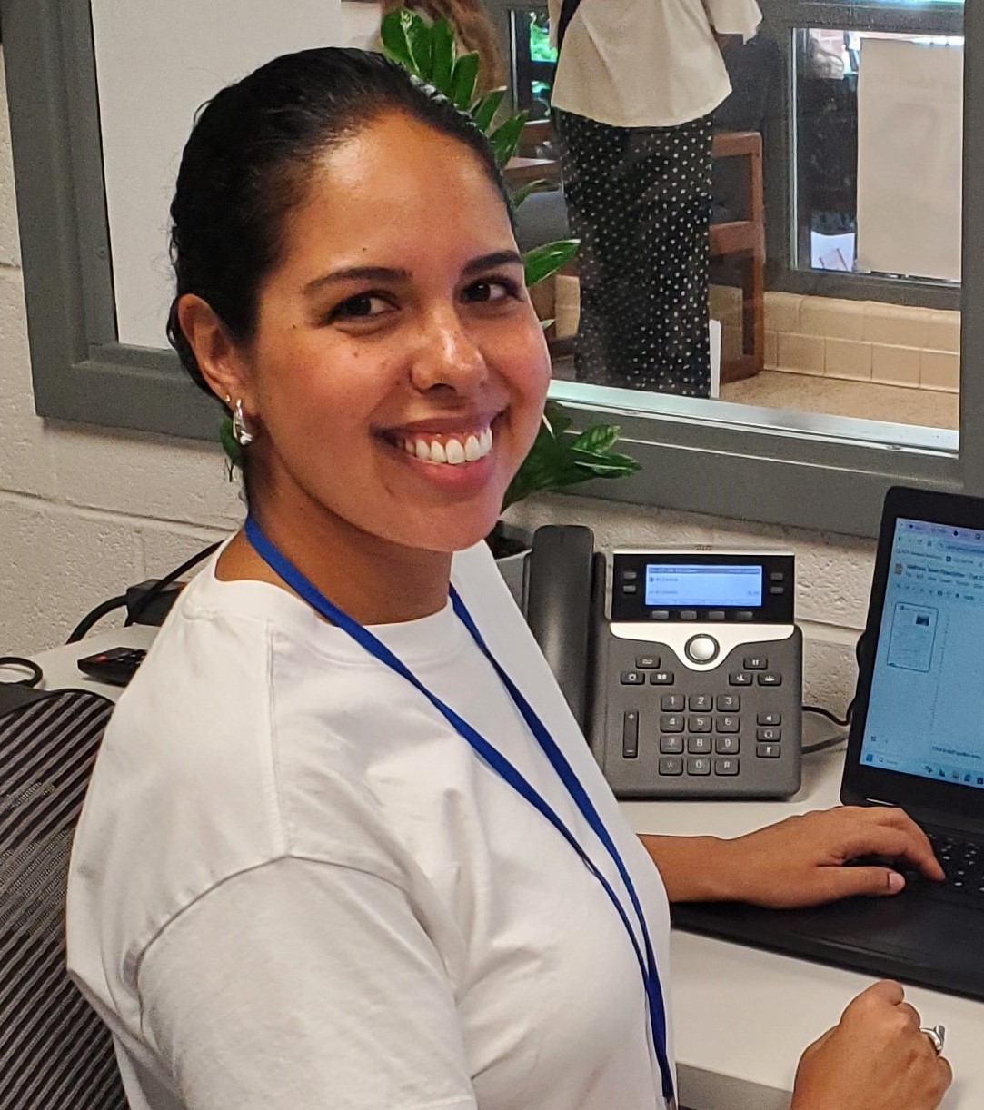 Family Liaison Ms. Howard at her computer