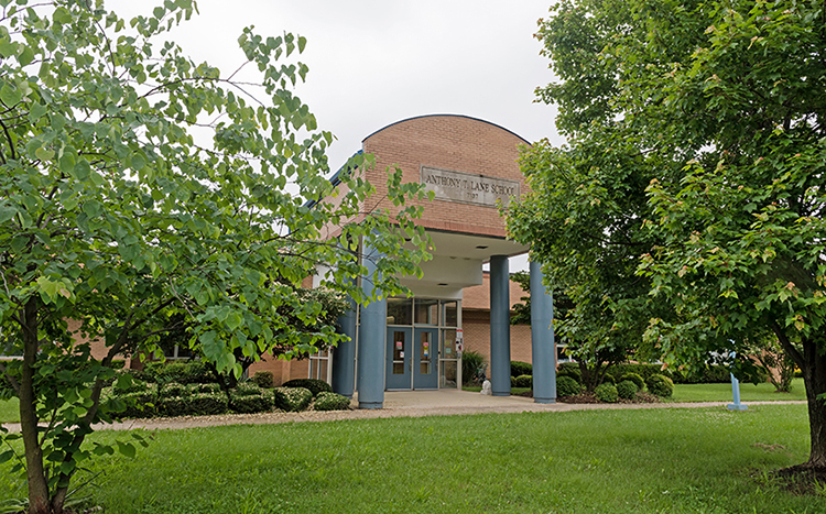 Color photograph of the main entrance to Lane Elementary School. The picture was taken in June 2018.